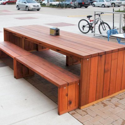 Maynard Modern Redwood Patio Table (Options: 10' L, 40 1/4" W Tabletop, Side Benches, Redwood, 2 Half Length Maynard Benches Per Side, Standard Tabletop, No Umbrella Hole, Transparent Sealant). Photo courtesy of Whole Foods Mkt, 6601 South Fry Rd. Katy, Texas.