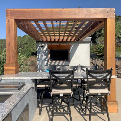 Custom Modern Fat Timber Pergola (Options: 20' L x 14' W, California Redwood, No Rain Guard, 9 ft H, No Electrical Wiring Trim, No Curtain Rods, Attached to Existing Building, 2-Post Anchor Kit for Concrete, No Post Decorative Trims, No Ceiling Fan Base, Transparent Premium Sealant). Photo Courtesy of Andy D'amico of Soquel, CA.
