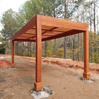 Modern Louvered Garden Pergola (Options: 22' L x 10' W, 8'' x 8'' Posts, Mobile Louvers, California Redwood, 9.5 ft H, No Electrical Wiring Trim, 4 Post Anchor Kit for High-Wind, No post decorative trims, No Ceiling Fan Base, Transparent Premium Sealant). The post anchors were placed above grade, so that the final hardscape can be poured over the footings so that there is no joint showing and the final hardscape will be seamless. Photo Courtesy of M. Graff of Atlanta, Georgia.