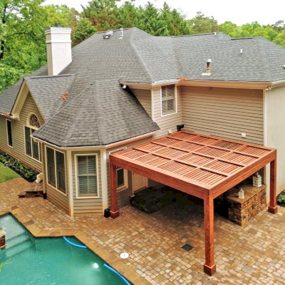 Modern Louvered Garden Pergola (Options: 15' L x 15' W, 8'' x 8'' Posts, Mobile Louvers, Douglas-fir, 9 ft H, 1 Electrical Wiring Trim, 2 Curtain Rods, 4 Post Anchor Kit for Concrete, No Post Decorative Trims, 1 Ceiling Fan Base, Coffee-Stain Premium Sealant). Photo Courtesy of J. Mcknight of Smyrna, Georgia.