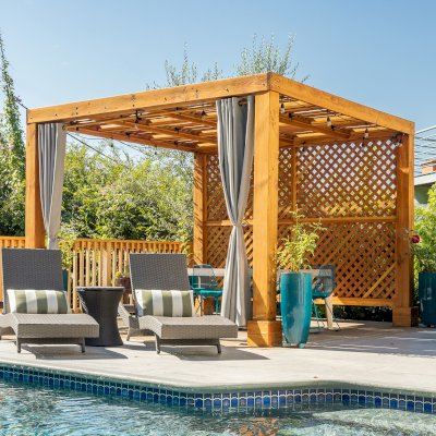 Modern Louvered Garden Pergola (Options: 12' L x 12' W, 8'' x 8'' Posts, Mobile Louvers, Douglas-fir, with 1 Lattice Privacy Wall, Electrical Wiring Trim for 1 Post, Without Fascia, No Curtain Rods, 4 Post Anchor Kit for Wood, No Post Decorative Trims, No Ceiling Fan Base, Transparent Premium Sealant). Photo Courtesy of S. Weinswig of Los Angeles, CA.