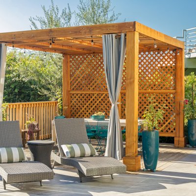 Modern Louvered Garden Pergola (Options: 12' L x 12' W, 8'' x 8'' Posts, Mobile Louvers, Douglas-fir, with 1 Lattice Privacy Wall, Electrical Wiring Trim for 1 Post, Without Fascia, No Curtain Rods, 4 Post Anchor Kit for Wood, No Post Decorative Trims, No Ceiling Fan Base, Transparent Premium Sealant). Photo Courtesy of S. Weinswig of Los Angeles, CA.