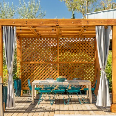 Modern Louvered Garden Pergola (Options: 12' L x 12' W, 8'' x 8'' Posts, Mobile Louvers, Douglas-fir, with 1 Lattice Privacy Wall, Electrical Wiring Trim for 1 Post, Without Fascia, No Curtain Rods, 4 Post Anchor Kit for Wood, No Post Decorative Trims, No Ceiling Fan Base, Transparent Premium Sealant). Photo Courtesy of S. Weinswig of Los Angeles, CA.
