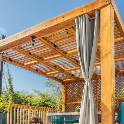 Modern Louvered Garden Pergola (Options: 12' L x 12' W, 8'' x 8'' Posts, Mobile Louvers, Douglas-fir, with 1 Lattice Privacy Wall, Electrical Wiring Trim for 1 Post, Without Fascia, No Curtain Rods, 4 Post Anchor Kit for Wood, No Post Decorative Trims, No Ceiling Fan Base, Transparent Premium Sealant). Photo Courtesy of S. Weinswig of Los Angeles, CA.