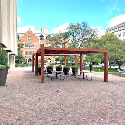 Modern Louvered Garden Pergolas (Options: 20' L x 20' W, 10'' x 10'' Posts [Anchor System for 8X8 Posts with Trim Pieces Flush for 10X10 Posts], Fixed, California Redwood, 9 ft H, No Electrical Wiring Trims, 4 Post Anchor Kit for Concrete, No Post Decorative Trims, No Ceiling Fan Base, Transparent Premium Sealant). Photo Courtesy of the University of Chicago.