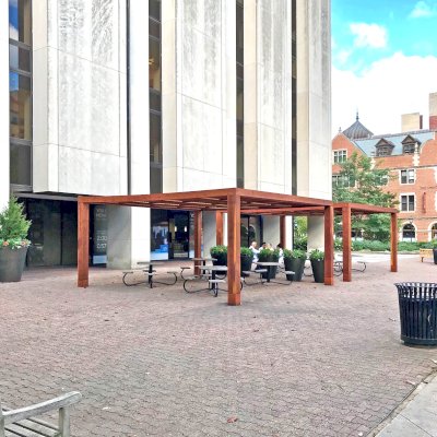 Modern Louvered Garden Pergolas (Options: 20' L x 20' W, 10'' x 10'' Posts [Anchor System for 8X8 Posts with Trim Pieces Flush for 10X10 Posts], Fixed, California Redwood, 9 ft H, No Electrical Wiring Trims, 4 Post Anchor Kit for Concrete, No Post Decorative Trims, No Ceiling Fan Base, Transparent Premium Sealant). Photo Courtesy of the University of Chicago.
