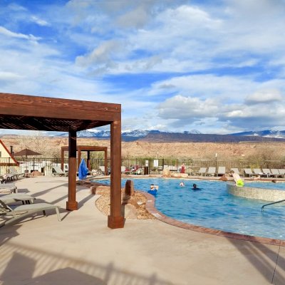 Modern Louvered Garden Pergola (Options: 10' L x 10' W, 8'' x 8'' Posts, Mobile Louvers, Douglas-fir, 9.5 ft H, No Electrical Wiring Trim, 4 Curtain Rods, 4 Post Anchor Kit for Concrete, No Post Decorative Trims, No Ceiling Fan Bases, Coffee-Stain Premium Sealant). Photo Courtesy of D. Tuzi of Moab, Utah.