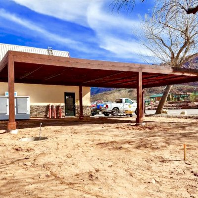 Modern Louvered Garden Pergola (Options: 40' L x 24' W, 8'' x 8'' Posts, Mobile Louvers, Douglas-fir, 9.5 ft H, No Electrical Wiring Trim, 4 Curtain Rods, 4 Post Anchor Kit for Concrete, No Post Decorative Trims, No Ceiling Fan Bases, Coffee-Stain Premium Sealant). Photo Courtesy of D. Tuzi of Moab, Utah.