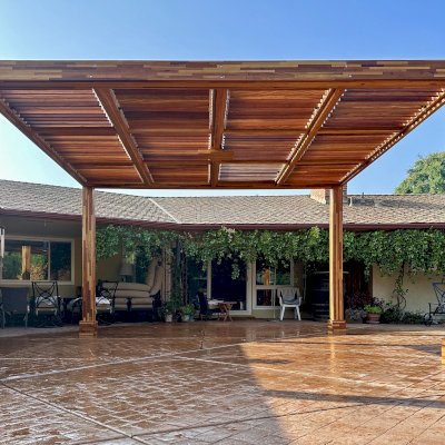Modern Louvered Garden Pergola (Options: 16' L x 14' W, 8'' x 8'' Posts, Mobile Louvers, Mosaic Redwood, 9.5 ft H, No Electrical Wiring Trim, No Curtain Rods, 4 Post Anchor Kit for Concrete, No Post Decorative Trims, 1 Ceiling Fan Base, Transparent Premium Sealant). Photo Courtesy of J. Holmquist of Madera, CA.