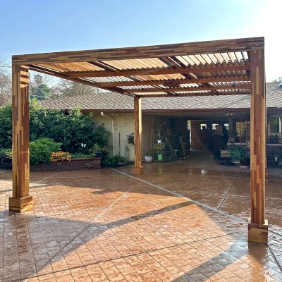 Modern Louvered Garden Pergola (Options: 16' L x 14' W, 8'' x 8'' Posts, Mobile Louvers, Mosaic Redwood, 9.5 ft H, No Electrical Wiring Trim, No Curtain Rods, 4 Post Anchor Kit for Concrete, No Post Decorative Trims, 1 Ceiling Fan Base, Transparent Premium Sealant). Photo Courtesy of J. Holmquist of Madera, CA.