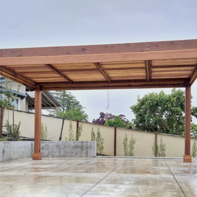Modern Louvered Garden Pergola (Options: 20' L x 10' W, 8'' x 8'' Posts, Mobile Louvers, California Redwood, No Privacy Wall, Electrical Wiring Trim for 2 Posts, With Fascia, 4 Curtain Rods, 4 Post Anchor Kit for Concrete, No Post Decorative Trims, No Ceiling Fan Base, Transparent Premium Sealant). Photo Courtesy of J. Holder of Lafayette, CA.