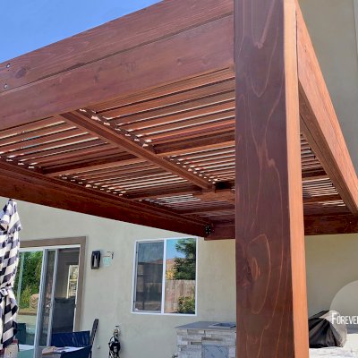 Modern Louvered Garden Pergola (Options: 16' L x 10' W, 8" x 8" Posts, Mobile Louvers, California Redwood, 9.5 ft H, 1 Electrical Wiring Trim, No Curtain Rods, 2 Post Anchor Kit for Concrete, Attached to Wall by Custom Request, No Post Decorative Trims, 1 Ceiling Fan Base, Coffee Stain Premium Sealant). Photo Courtesy of J. Murphy of Eldorado Hills, California.