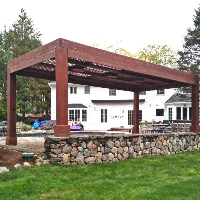 Modern Louvered Garden Pergola (Options: 24' L x 12' W, 10'' x 10'' Posts, Mobile Louvers, California Redwood, 10 ft H [2 Posts Shorter Seating Atop the Pony Wall], No Electrical Wiring Trim, 4 Curtain Rods, 4 Post Anchor Kit for Concrete, No Post Decorative Trims, 2 Ceiling Fan Bases, Coffee-Stain Premium Sealant). Photo Courtesy of J. VanderKamp of Westport, Connecticut.