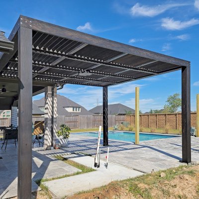 Modern Louvered Garden Pergola (Options: 16' L x 14'-6'' W, 8'' x 8'' Posts, Mobile Louvers, Douglas-fir, Electrical Wiring Trim for 1 Post, Without Fascia, No Curtain Rods, 4 Post Anchor Kit for Concrete, No Post Decorative Trims, 1 Ceiling Fan Base, Black Stain Premium Sealant). Photo Courtesy of J. Roan of Katy, TX.