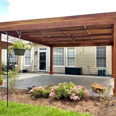 Modern Louvered Garden Pergola (Options: 16' L x 16' W, 8'' x 8'' Posts, Mobile Louvers, California Redwood, 9 ft H, No Electrical Wiring Trim, No Curtain Rods, 4 Post Anchor Kit for Concrete, No Post Decorative Trims, No Ceiling Fan Base, Transparent Premium Sealant). Photo Courtesy of J. McLaughlin of Cary, North Carolina.