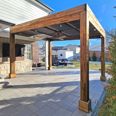 Modern Louvered Garden Pergola (Options: 14' L x 10' W, 8'' x 8'' Posts, Mobile Louvers, Mosaic Redwood, 9.5 ft H, Electrical Wiring Trim Kit for 1 Post, No Curtain Rods, Post Anchor Kit for Concrete, No Post Decorative Trims, 1 Ceiling Fan Base, Custom Weather Gray Finish Treatment). Photo Taken 1 Year After Installation. Photo Courtesy of M. Cleary of St. Louis, MO.