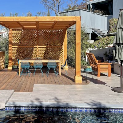 Modern Louvered Garden Pergola (Options: 12' L x 12' W, 8'' x 8'' Posts, Mobile Louvers, Douglas-fir, with 1 Lattice Privacy Wall, Electrical Wiring Trim for 1 Post, Without Fascia, No Curtain Rods, 4 Post Anchor Kit for Wood, No Post Decorative Trims, No Ceiling Fan Base, Transparent Premium Sealant). Photo Courtesy of S. Weinswig of Los Angeles, CA.