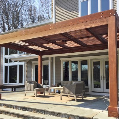 Modern Louvered Garden Pergola (Options: 10' L x 17' W, 8'' x 8'' Posts, Mobile Louvers, California Redwood, 9 ft H, No Electrical Wiring Trim, 4 Post Anchor Kit for Concrete, No post decorative trims, With a Ceiling Fan Base, Coffee-Stain Premium Sealant). Photo Courtesy of A. Gree of Redding, CT.