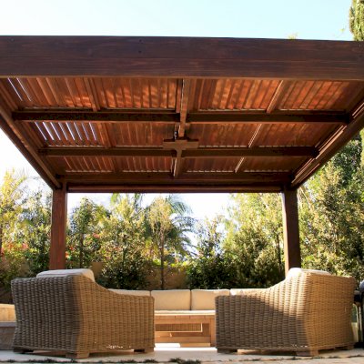 Modern Louvered Garden Pergola (Options: 16' L x 16' W, 10'' x 10'' Posts, Mobile Louvers, California Redwood, 9.5ft H, Electrical Wiring Trim for 1 Post, 4 Post Anchor Kit for Concrete, No post decorative trims, Add a Ceiling Fan Base, 4 Curtain Rods, Coffee Stain Sealant). Photo Courtesy of S. Gillin of Del Mar, CA.