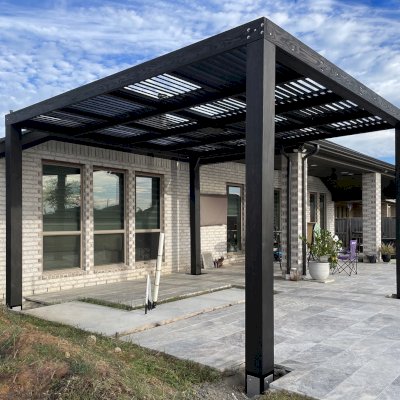 Modern Louvered Garden Pergola (Options: 16' L x 14'-6" W, 8'' x 8'' Posts, Mobile Louvers, Douglas-fir, Electrical Wiring Trim for 1 Post, Without Fascia, No Curtain Rods, 4 Post Anchor Kit for Concrete, No Post Decorative Trims, 1 Ceiling Fan Base, Black Stain Premium Sealant). Photo Courtesy of J. Roan of Katy, TX.