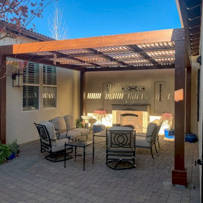 Modern Louvered Garden Pergola (Options: 16' L x 16' W, 8'' x 8'' Posts, Mobile Louvers, California Redwood, 9.5 ft H, No Electrical Wiring Trim, No Curtain Rods, 4 Post Anchor Kit for Concrete, No Post Decorative Trims, No Ceiling Fan Base, Coffee-Stain Premium Sealant). Photo Courtesy of T. Duvall of Reno, Nevada.