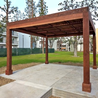 Modern Louvered Garden Pergola (Options: 14' L x 14' W, 8'' x 8'' Posts, Fixed Louvers, California Redwood, 9.5 ft H, No Electrical Wiring Trim, 4 Post Anchor Kit for Concrete, No post decorative trims, With a Ceiling Fan Base, Coffee-Stain Premium Sealant). Photo Courtesy of M. Ramirez of Long Beach, CA.
