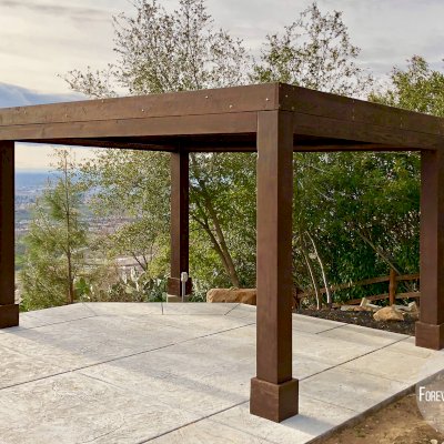 Modern Louvered Garden Pergola (Options: 16' L x 12' W, 10'' x 10'', Fixed Louvers, Douglas-fir, 9.5 ft H, No Electrical Wiring Trim Kit, 4 Post Anchor Kit for Concrete, No Post Decorative Trims, No Ceiling Fan Base, 4 Curtain Rods, Coffee Stain Sealant). Photo Courtesy of R. McCan of El Dorado Hills, CA.