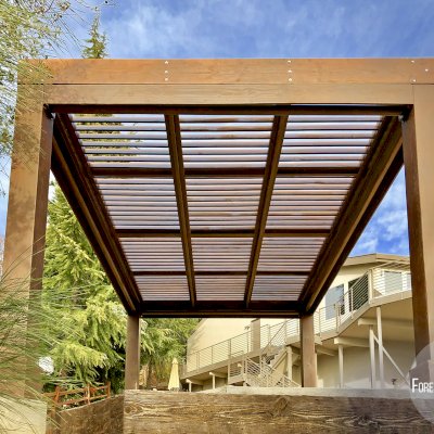 Modern Louvered Garden Pergola (Options: 16' L x 12' W, 10'' x 10'', Fixed Louvers, Douglas-fir, 9.5 ft H, No Electrical Wiring Trim Kit, 4 Post Anchor Kit for Concrete, No Post Decorative Trims, No Ceiling Fan Base, 4 Curtain Rods, Coffee Stain Sealant). Photo Courtesy of R. McCan of El Dorado Hills, CA