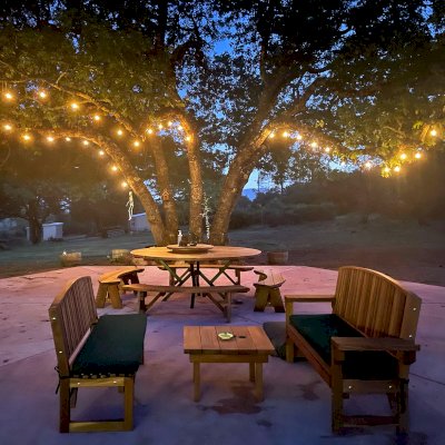 Moonlight Redwood Benches (Options: 5 ft, No Shelf, California Redwood, with Cushion, No Engraving, Transparent Premium Sealant [One Bench with 5 1/2" Wide Level Armrests]). Photo Courtesy of A. Paul of Lower Lake, C.