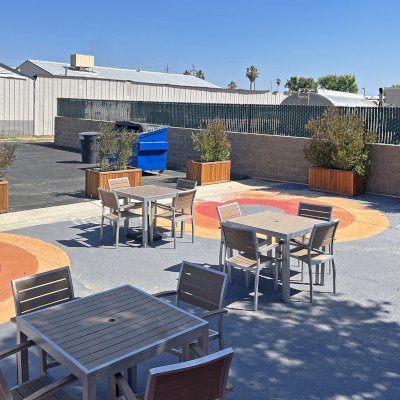 Napa Planters (Options: 48'' L x 24'' W x 24'' H, California Redwood, 1-inch Feet, Transparent Premium Sealant). Photo Taken 1 Year After Installation. Photo Courtesy of D. Frans of Shafter, CA.