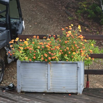 Custom Napa Planter with horizontal boards and gray primer finish, 12 years after installation and never refinished.
