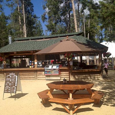 Octagonal Picnic Table (Options: 6' Diameter Tabletop, Attached Benches, Douglas-fir, Standard Tabletop, Rounded Corners, Umbrella Hole, Transparent Premium Sealant). Photo Courtesy of Jeff C. of Stanley, Idaho.