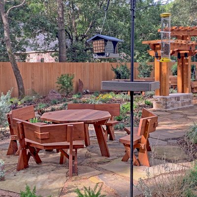 Octagonal Picnic Table (Options: 5' Diameter Tabletop, Unattached Benches [Benches with Backrests by Custom Request], Mature Redwood, Standard Tabletop, Rounded Corners, 1 5/8" Umbrella Hole, Transparent Premium Sealant). Photo Courtesy of Don and Rhonda Martone of Spring, Texas.