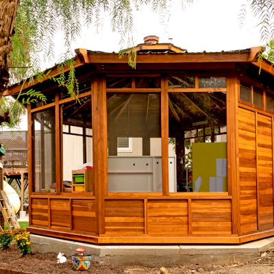 Octagonal Sunroom Gazebo (Options: 16' Diameter, Internal Deck, California Redwood, 24" H Siding Below Windows, 4 Standard Window Panels & 3 Custom Panels, Clear Acrylic, 1 Ceiling Fan Base, 1 Set of Doors, Transparent Premium Sealant). Photo Courtesy of D. Coons of Morgan Hill, California.