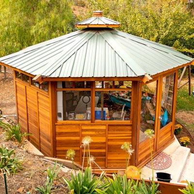 Octagonal Sunroom Gazebo (Options: 16' Diameter, Internal Deck, California Redwood, 24" H Siding Below Windows, 4 Standard Window Panels & 3 Custom Panels, Clear Acrylic, 1 Ceiling Fan Base, 1 Set of Doors, Transparent Premium Sealant). Photo Courtesy of D. Coons of Morgan Hill, California.