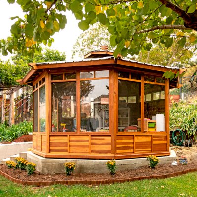 Octagonal Sunroom Gazebo (Options: 16' Diameter, Internal Deck, California Redwood, 24" H Siding Below Windows, 4 Standard Window Panels & 3 Custom Panels, Clear Acrylic, 1 Ceiling Fan Base, 1 Set of Doors, Transparent Premium Sealant). Photo Courtesy of D. Coons of Morgan Hill, California.