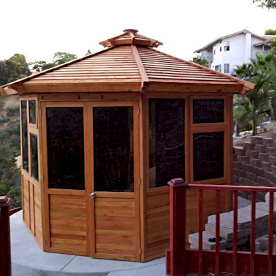 Octagonal Sunroom Gazebo (Options: 12' Diameter, No Deck, Douglas-fir, 36" H Siding Below Windows, 4 Window Panels & Solid Panels, 2 Sets of Doors, Transparent Premium Sealant). Photo Courtesy of Y. Fang of Diamond Bar, CA.