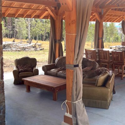 Oversized Coffee Table (Options: 60" x 36", California Redwood, Standard Tabletop, No Drawers, Transparent Premium Sealant). Redwood Cocktail Bar Stools in Background. Furniture was made as part of Toledo Pavilion project. Photo Courtesy of R. Barry of Hayden, Colorado.