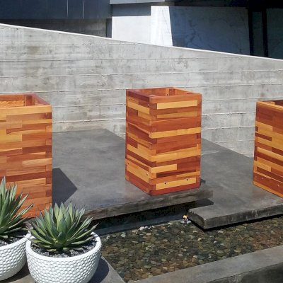 Parquet Planters (Options: Left [24in L x 24in W x 30in H], Center and Right [24in L x 18in W x 30in H], Mosaic Redwood, No Base or Casters, No Trellis, Interior and Exterior of Box with Sealant (No Growing Vegetables), Transparent Premium Sealant). Photo Courtesy of M. Stratton of Los Angeles, CA.