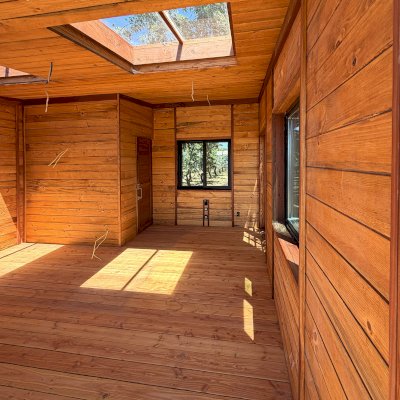 Custom Palo Alto Backyard Cabin (Options: 18' L, 16' W, With 19' x 19' Structural Deck with Steps, California Redwood for Exterior Finished, Douglas-fir Internal Walls and Framing, Double Door, Slidding Windows, Windows Purchased Locally, With Two 2' x 2' Skylights, Metal Roof, Electrical Wire Trim on the Walls, Transparent Premium Sealant). Photo Courtesy of R. and M. Hegwood of Ceres, CA.