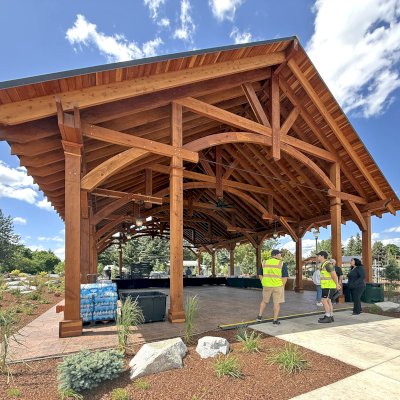 Cardinal's Nest Pavilion (Options: 60' x 40', California Redwood, Horizontal Decorative Trims for All Posts, 15' H Posts, 10x10 Posts, 2 Ceiling Fan Bases, Transparent Premium Sealant). Pavilion Installed in Faith Walk Community Fitness Park in Coeur d'Alene, Idaho.