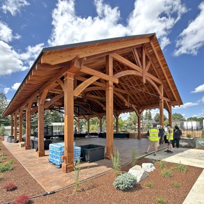 Cardinal's Nest Pavilion (Options: 60' x 40', California Redwood, Horizontal Decorative Trims for All Posts, 15' H Posts, 10x10 Posts, 2 Ceiling Fan Bases, Transparent Premium Sealant). Pavilion Installed in Faith Walk Community Fitness Park in Coeur d'Alene, Idaho.