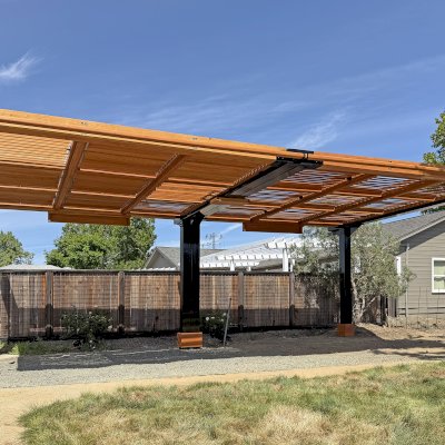 Custom Modern Louvered Garden Pergola (Options: 28' L x 15.5' W, Douglas-Fir, Mobile Louvered Panels, 1 Ceiling Fan Base and 2 Accessory Bases, with Curtain Rods, with Metal Posts and Supports by Custom Request, Transparent Premium Sealant). Photo Courtesy of C. Hedberg of St. Helena, CA.