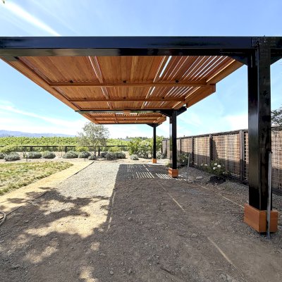 Custom Modern Louvered Garden Pergola (Options: 28' L x 15.5' W, Douglas-Fir, Mobile Louvered Panels, 1 Ceiling Fan Base and 2 Accessory Bases, with Curtain Rods, with Metal Posts and Supports by Custom Request, Transparent Premium Sealant). Photo Courtesy of C. Hedberg of St. Helena, CA.