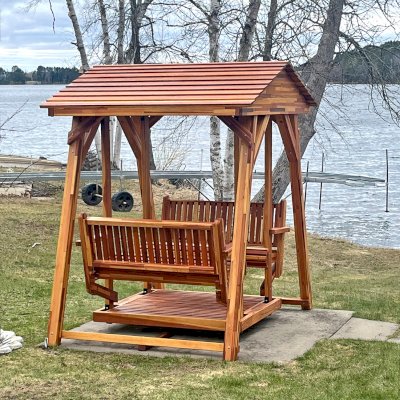 St. Anthony's Face to Face Gliders (Options: Extra Wide, Mosaic Redwood, Without Beverage Armrests, No Kid's Platform, Standard Closed Roof, No Engraving, Transparent Premium Sealant). Photo Courtesy of G. Isaacson of Gilbert, MN.