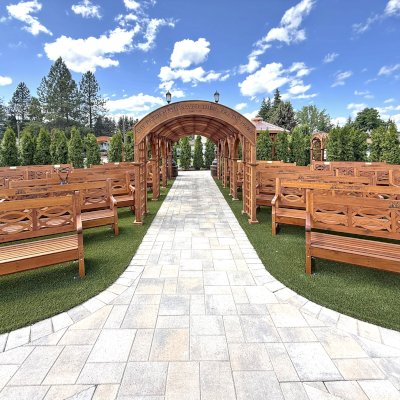 Victorian Trellis (Options: 22' x 8', California Redwood, Custom Engraving, Transparent Premium Sealant). Photo Also Shows Several Hennell Garden Benches. Trellis Installed in Faith Walk Community Fitness Park in Coeur d'Alene, Idaho.