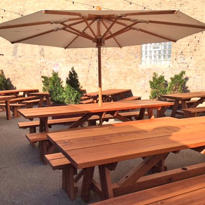 Custom Forever Picnic Tables (Unattached Benches) (Options: 10' L, 34 ½in W, Old-Growth, 2 Full Length Side Benches, Standard Tabletop, Squared Corners, 2 ½in Umbrella Hole, Standard Leg Flair, Transparent Premium). Using Two Tongue & Groove Matching 5 3/4" Boards to Create the Appearance of an 11 1/2" Wide Board Construction. Photo courtesy of Small Cheval Restaurant, 1732 N Milwaukee Ave, Chicago, IL 60647.