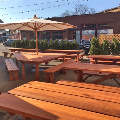 Custom Forever Picnic Tables (Unattached Benches) (Options: 10' L, 34 ½in W, Old-Growth, 2 Full Length Side Benches, Standard Tabletop, Squared Corners, 2 ½in Umbrella Hole, Standard Leg Flair, Transparent Premium). Using Two Tongue & Groove Matching 5 3/4" Boards to Create the Appearance of an 11 1/2" Wide Board Construction. Photo Also Shows a Custom Triangular Picnic Table Set. Photo courtesy of Small Cheval Restaurant, 1732 N Milwaukee Ave, Chicago, IL 60647.