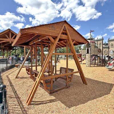 Custom Jean's Ultimate Swing Set (Options: California Redwood, with 2 Sets of Face-to-Face Swings, Custom Engraving Provided by Client, Transparent Premium Sealant). Installed in Faith Walk Community Fitness Park in Coeur d'Alene, Idaho.