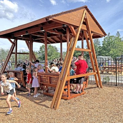 Custom Jean's Ultimate Swing Set (Options: California Redwood, with 2 Sets of Face-to-Face Swings, Custom Engraving Provided by Client, Transparent Premium Sealant). Installed in Faith Walk Community Fitness Park in Coeur d'Alene, Idaho.